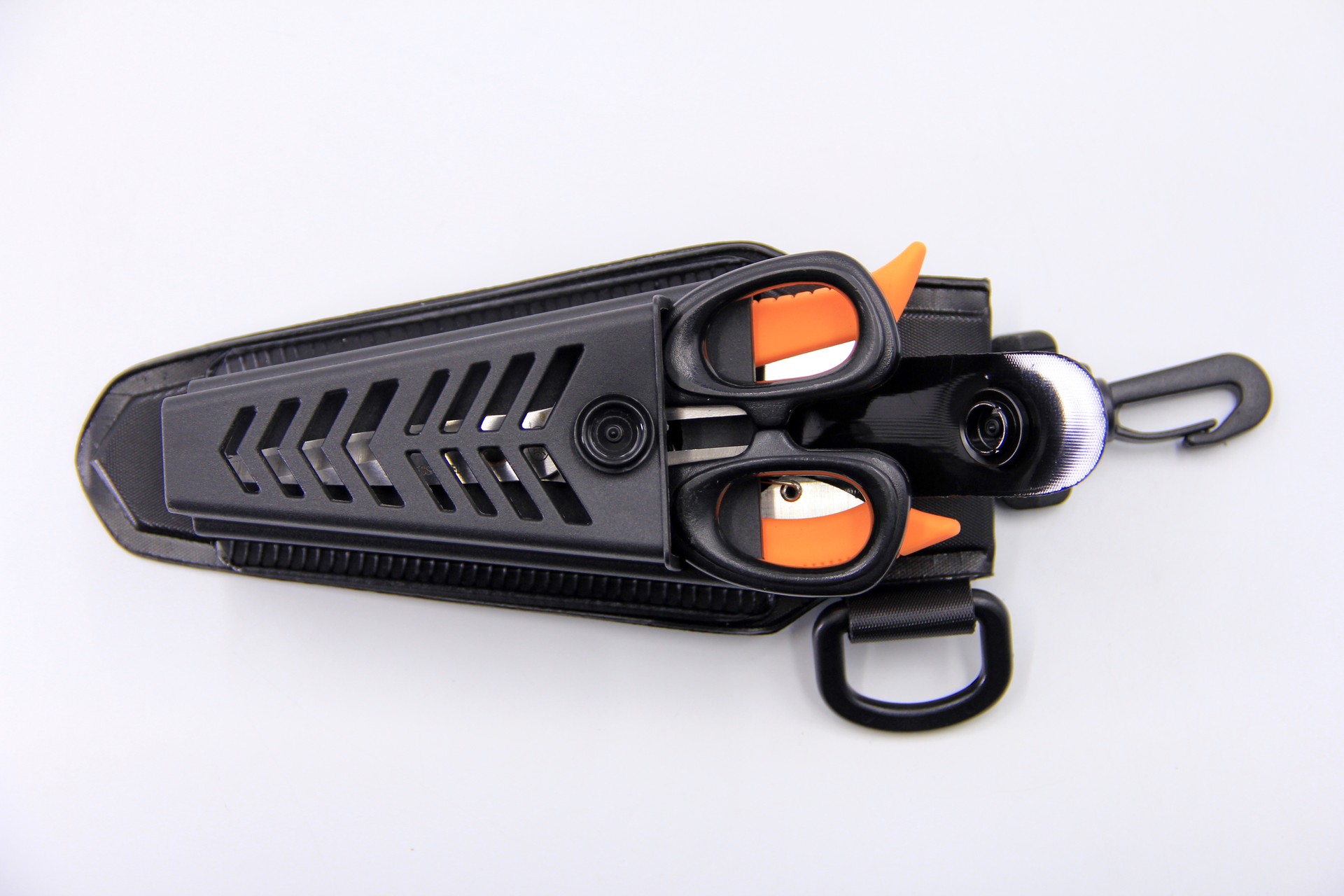 Top-down view of a WEFOX EVA plier pouch in black with chevron-patterned ventilation slots, featuring two fishing pliers with orange-accented handles secured in dual molded holders, alongside an attached LED light and carabiner clip with D-ring lanyard attachment on a white background.