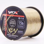 VFOX Invisible Key 15lb 0.25mm fishing line spool in light old gold, 900YD, black core on white background.