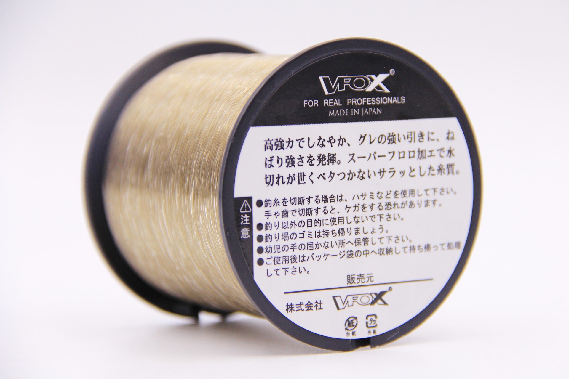 VFOX Invisible Key Fishing Line spool in light old gold, black label with Made in Japan text, side view on white background